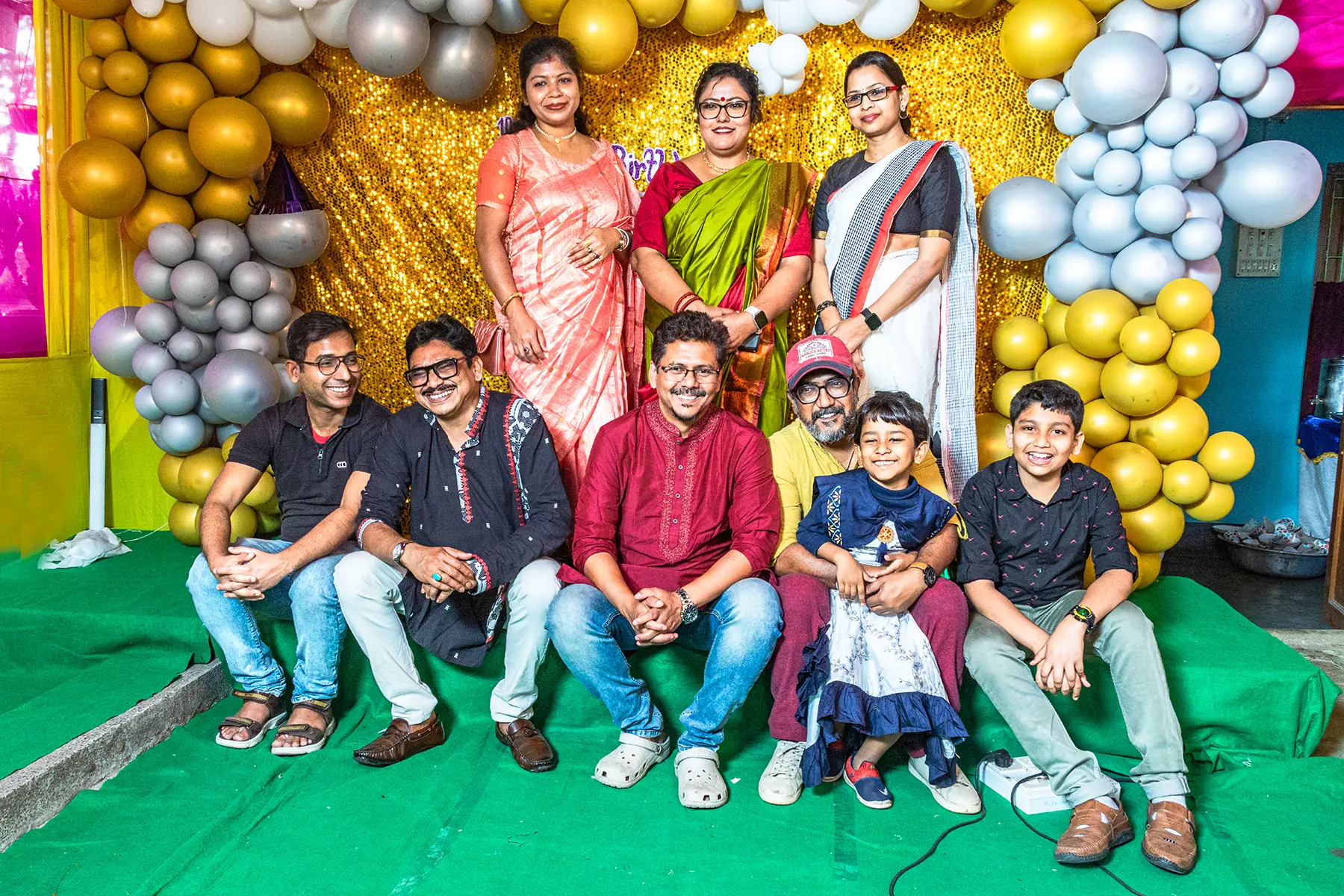 Family group portrait at Pablo’s birthday celebration in Baruipur