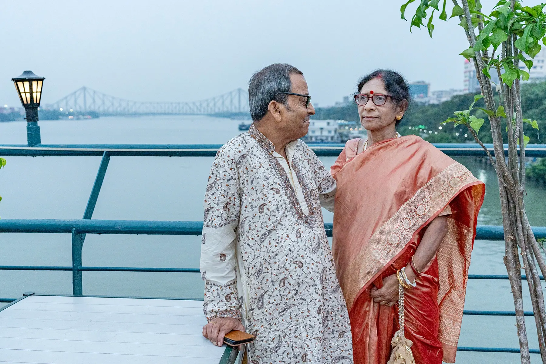 Anniversary couple portrait with Howrah Bridge photographed by Twin Lens