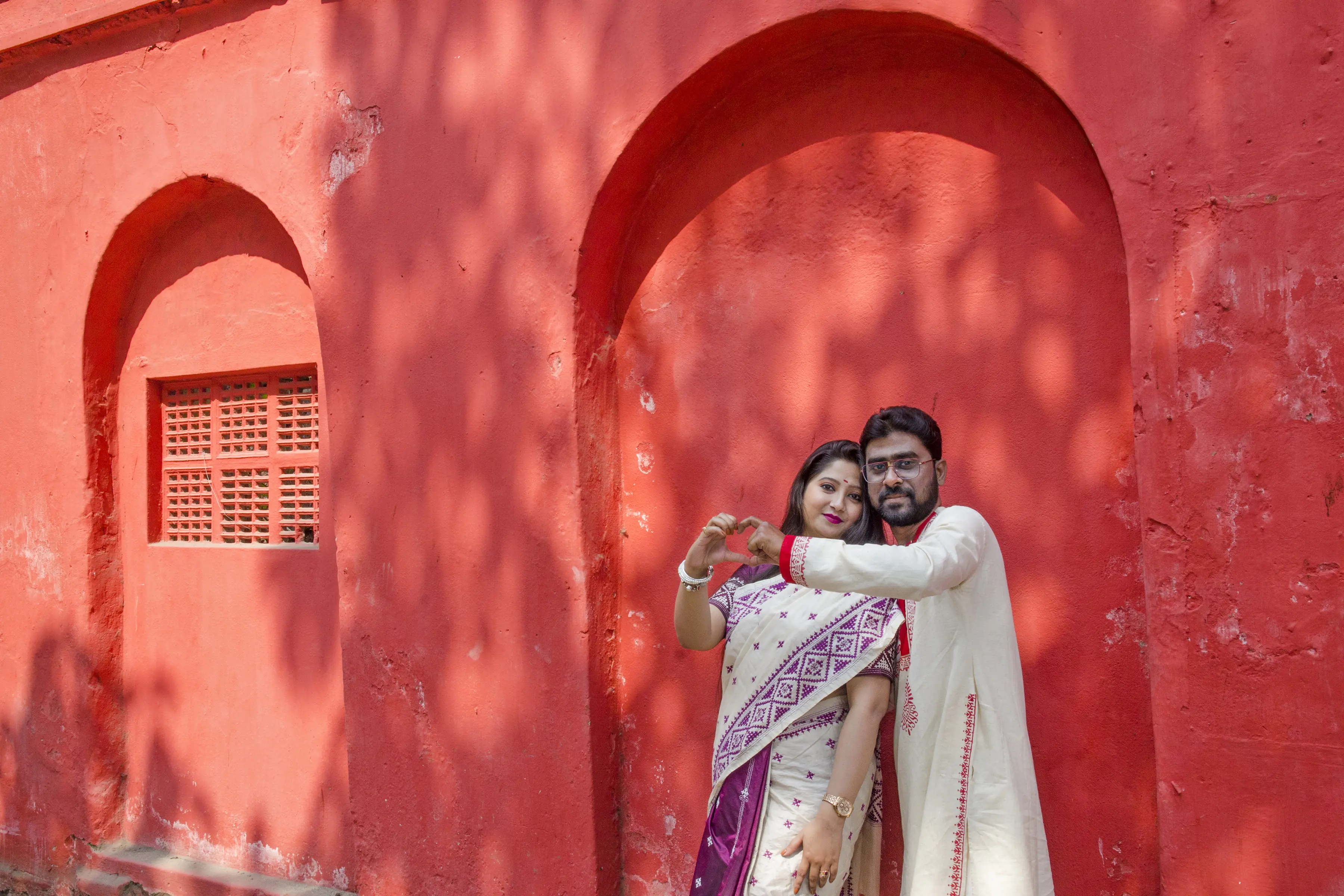 Romantic Red Wall Pre Wedding Portrait by Twin Lens Kolkata